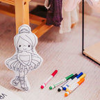 6402539f156d102fec901311_ballerina-doodle-leaning-against-chair-leg-with-markers-2_1771585210221.jpg