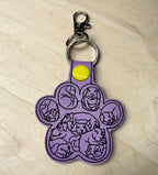 6402539f156d102fec901311_dog-paw-with-dog-faces-purple_1775991053021.jpg