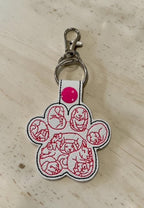 6402539f156d102fec901311_dog-paw-with-dog-faces-white-_1775991319539.jpg