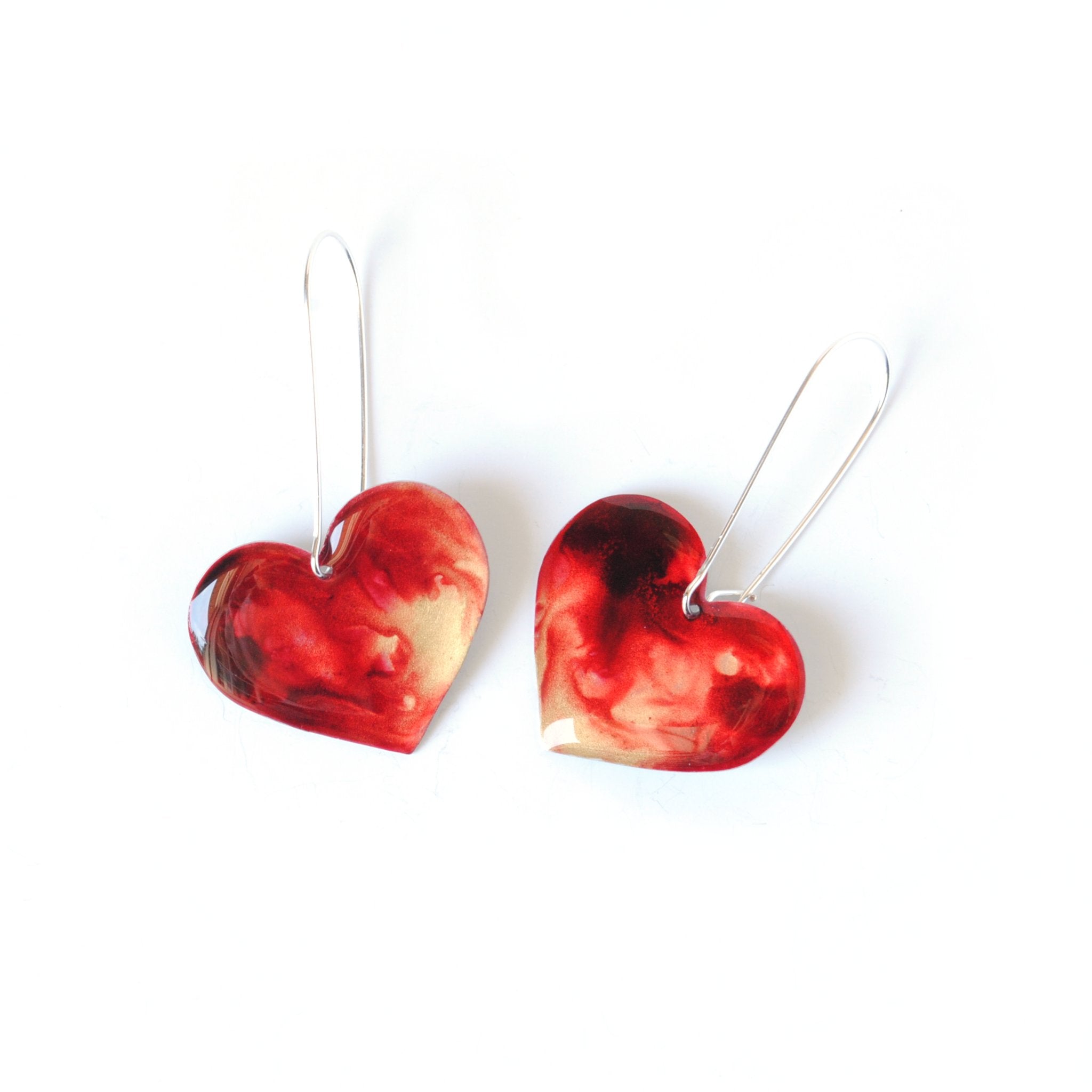 6402539f156d102fec901311_fiery-crimson-rosy-heart-earrings-front_1779557628658.jpg