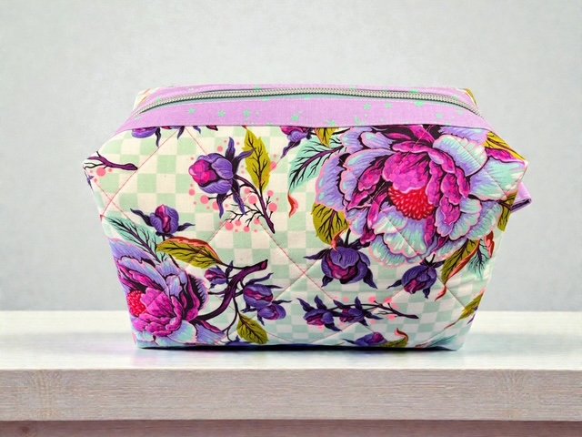 6402539f156d102fec901311_floral-pouch_1775437762485.jpg