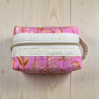 6402539f156d102fec901311_medium-lilly-of-the-valley-pouch_1775437941445.jpg