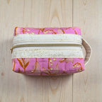 6402539f156d102fec901311_medium-lilly-of-the-valley-pouch_1775437941445.jpg