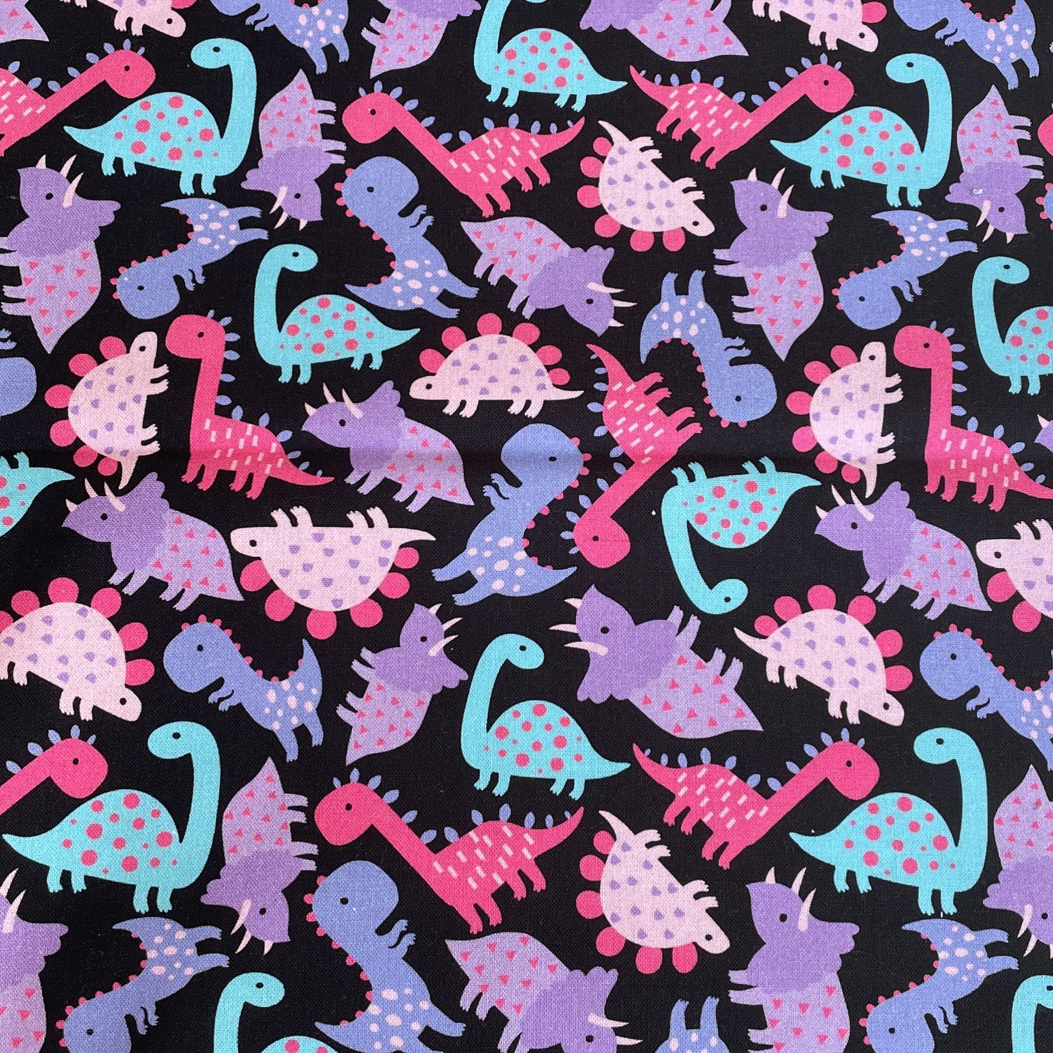 6402539f156d102fec901311_pink-dino-fabric_1780426934916.jpg