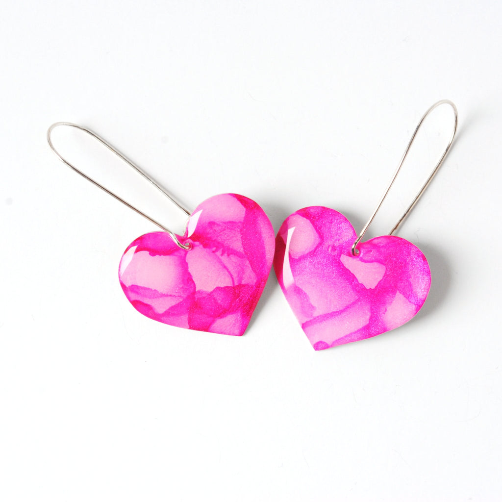 6402539f156d102fec901311_playful-in-pink-rosy-heart-earrings-from-the-top_1779555393800.jpg
