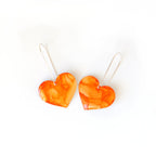 6402539f156d102fec901311_the-life-of-a-showgirl-rosy-heart-earrings-front_1779555379727.jpg